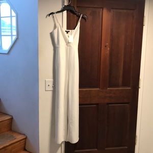 White/cream jumpsuit flared legs. Large never worn has tags. Brand name Episode